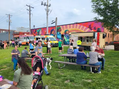 Music and Market Attendees enjoying food trucks