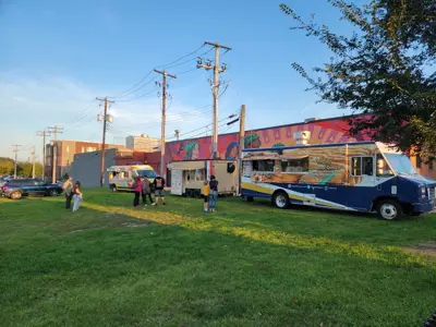 Food Trucks attending a Music and Market at sunset